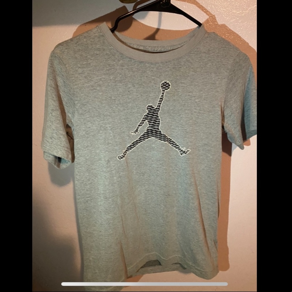 Grey and black Jordan tee.